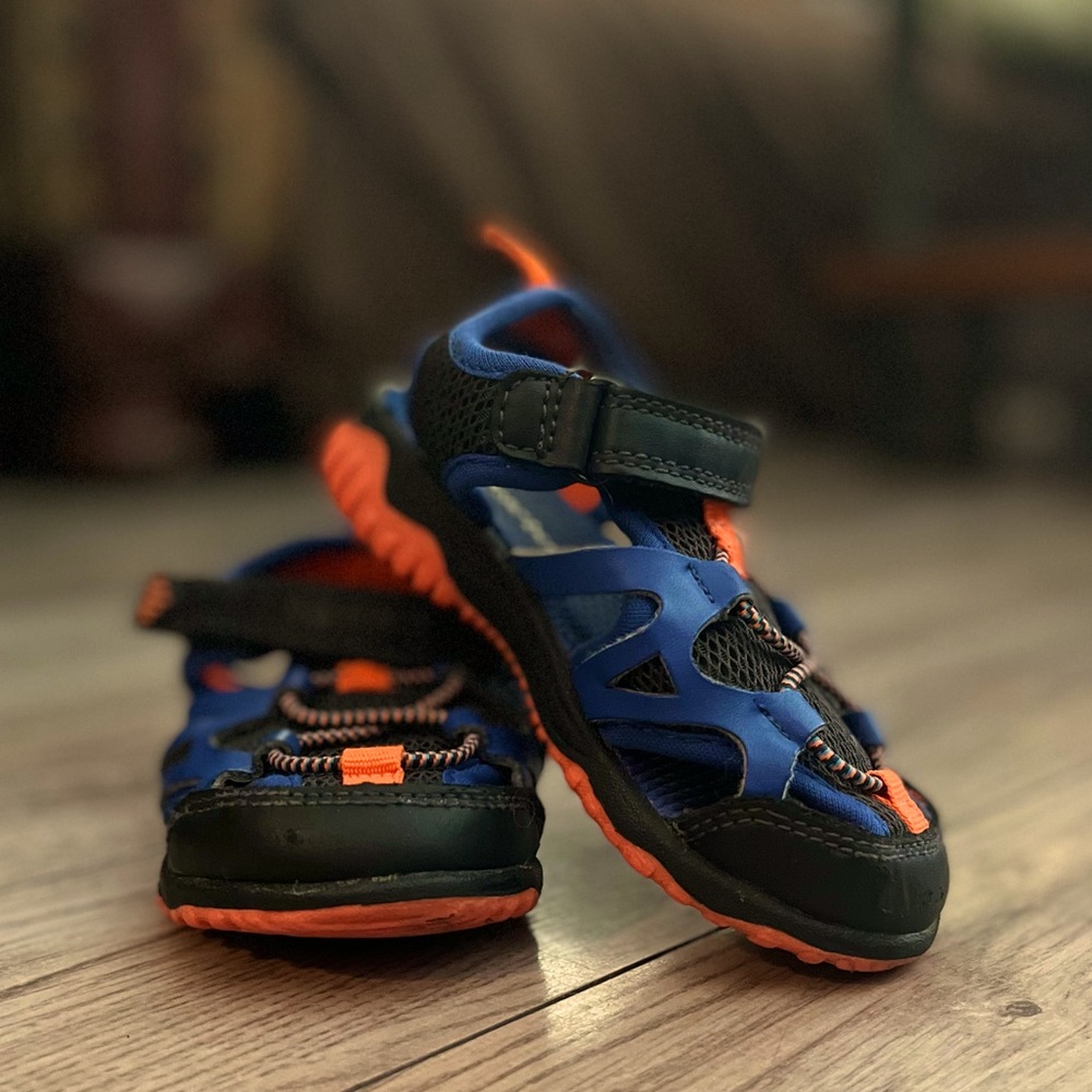 Carters; clean, navy and orange, size 7 watershoes. Goes on easy, super comfy!